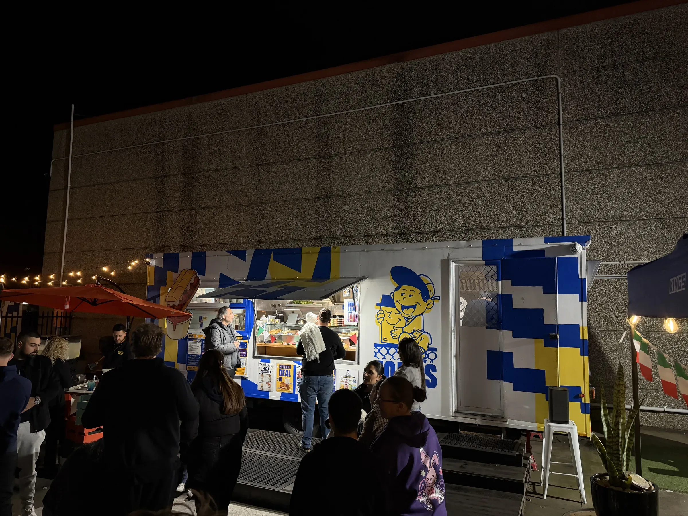 Crowd lining up at the Toby's Milkbar trailer during Toby's Little Italy night in Prestons
