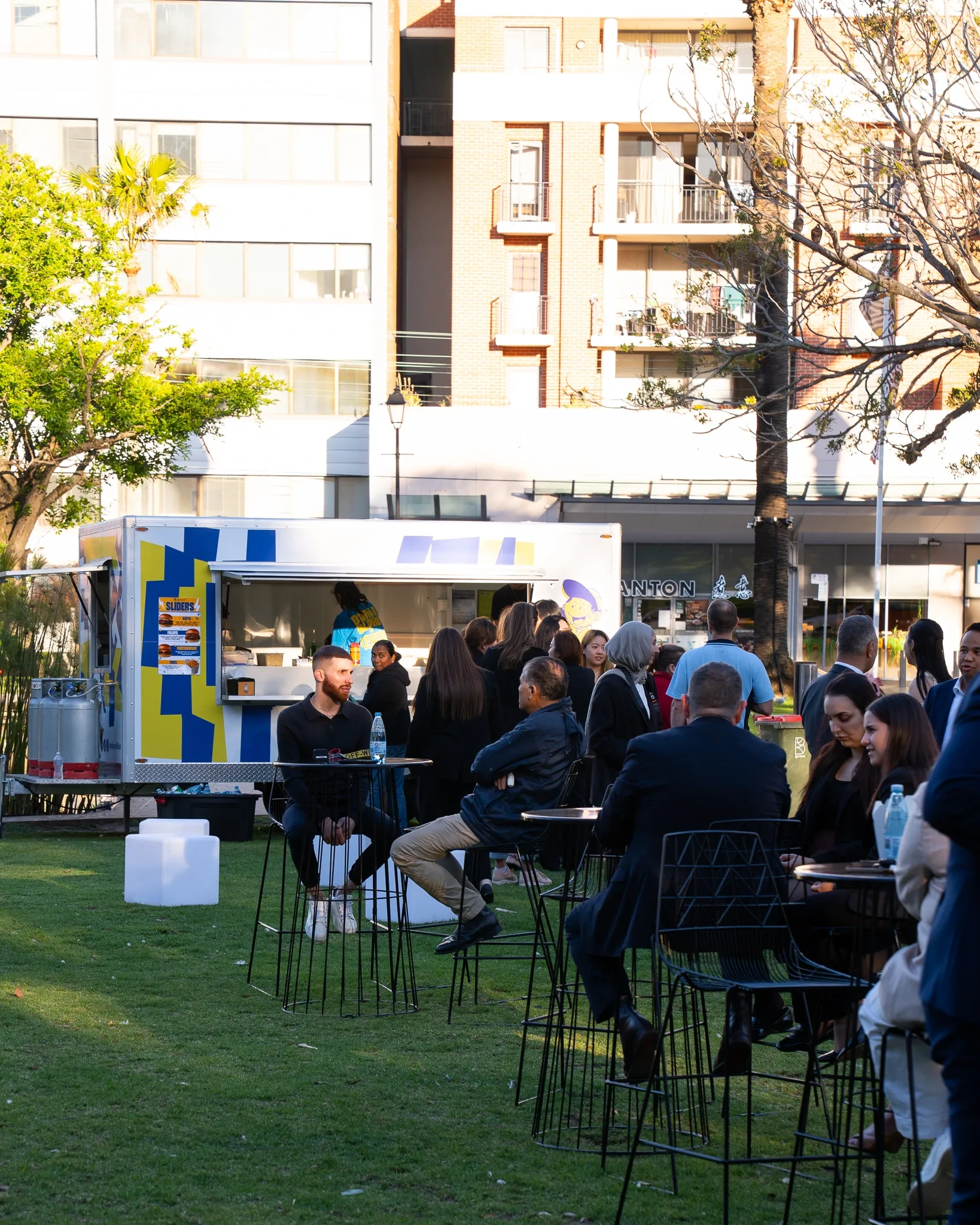 Guests at cocktail tables while Toby's Milkbar trailer serves the awards night
