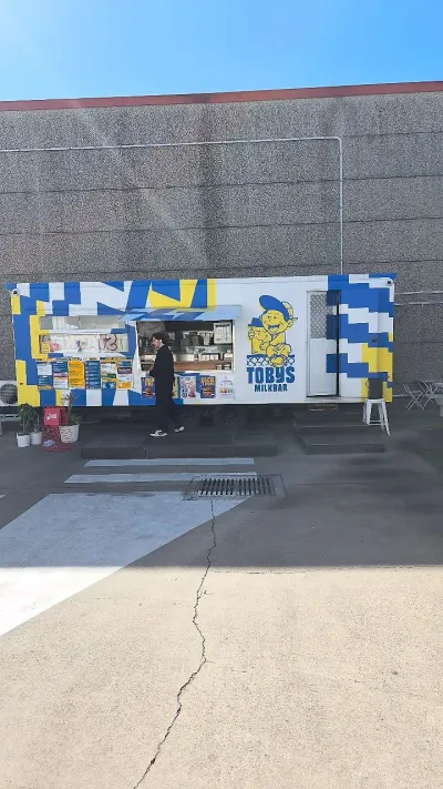 Instagram post: The outdoor sandwich bar setup at @tobysmilkbar is an absolute summer dream! 🥪☀